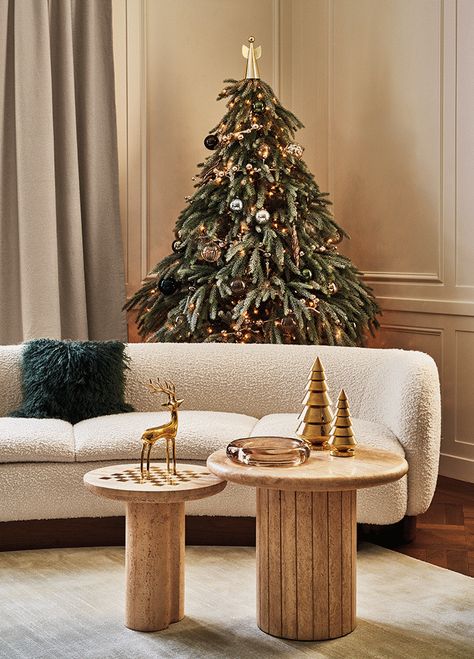 Modern Christmas Decorations | CB2 Cb2 Christmas, Christmas Sofa Decor, Christmas Sofa, Angel Christmas Tree Topper, Modern Christmas Decor, Christmas Tree Set, Reindeer Decorations, Holiday Snowmen, Brass Patina