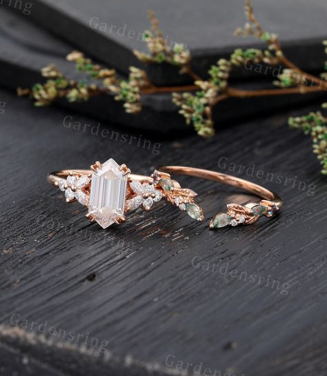 Long hexagon Moissanite Engagement ring Set Vintage moss agate engagement ring Rose gold Cluster shank marquise cut leaf Bridal set promise ABOUT THIS RING Beautiful Moissanite engagement ring set -------------------------------------------------------- 「Product Summary」 Engagement Ring * Center Stone: 5*10mm moissanite  or Simulated  Diamond (hexagon cut) * Side Stones: 1.5*3mm Marquise cut Moissanite                           1.7mm Round Moissanite Or Side Stone: Simulated Diamond * Total Cara Hexagon Engagement Ring, Moss Agate Engagement Ring, Moissanite Engagement Ring Set, Cute Engagement Rings, Agate Engagement Ring, Engagement Ring Rose Gold, Custom Wedding Rings, Full Eternity Ring, Ring Rose Gold