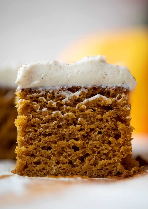 This pumpkin sheet cake is a legit pumpkin dream cake! It's so moist and fluffy and flavorful. With a blanket of cinnamon cream cheese frosting! Pumpkin Dream, Pumpkin Sheet Cake, Cold Cake, Pumpkin Bars, Pumpkin Treat, Cinnamon Cream Cheese Frosting, Different Cakes, Dream Cake, Piece Of Cake