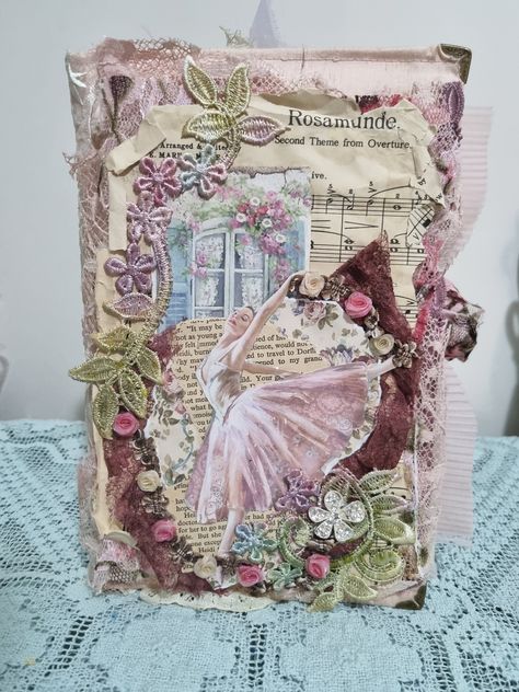 This junk journal titled "Rosamunde" is a very pretty ballet themed memory keeper perfect for anyone yourng or older who loves ballet and shabby chic style. It's A5 in size and a chunky soft covered journal. I have covered the outside with soft pink dupion silk, trimmed with 2 types of lace on the spine, with a closure of beautiful lace look soft net fabric as a tie.  Inside the pages are a combination of tea dyed paper, book pages, stamperia kit paper, and tracing paper; many are embellished wi Shabby Chic Journal Covers, Vintage Journal Cover, Shabby Chic Embellishments, Tea Dyed Paper, Shabby Chic Journal, Soft Cover Journal, Dyed Paper, Fabric Book Covers, Art Journal Techniques