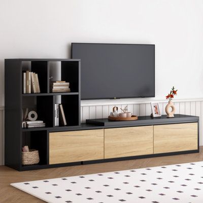 This adjustable TV stand offers a smooth extension range from 74.8" to 126", can be adapted to more sizes of TV, and meet more personable needs. By extending the right tabletop to a desired angle, you can efficiently utilize the space for storing additional items, thereby enhancing the overall functionality and efficiency of your home. Latitude Run® Colour: Black | Latitude Run® 74.8"-126" Extendable TV Stand w/ 3 Tier Bookshelves For Tvs Up To 110", Adjustable Entertainment Centre w/ Storage Ca Grey Tv Stand, Black Ivy, Bookshelf Storage, Storage Credenza, Red Chair, Wood Tones, Home Space, Tv Stands And Entertainment Centers, Brown Living Room