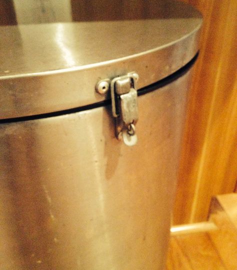 We have a stainless steel flip lid trash can in our kitchen. The hope was that the dog would not get into it, wrong. Bring on the second line of defense. I had several small hasps (locks, buckles, ???)out in the garage, so it was a very quick and easy hack to challenge his garbage eating ability. I set the can on its side, and laid the hasp on the front of the can. Half on the lid, the other half on the can (as it would be when closed and locked) and marked the holes with a sharpie. I drilled... Clean House Checklist, Dog Proof Trash Can, Cordless Drill Reviews, Pull Out Trash Cans, Cereal Containers, Your Trash, Can Lids, House Cleaning Checklist, Spring Cleaning Hacks