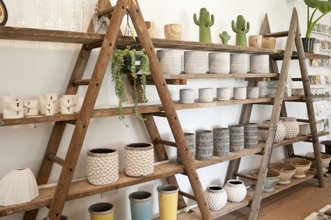 Ladder Market Display, Diy Store Shelves, Rustic Retail Display Ideas, Market Display Shelves, Camping Store Interior, Diy Shop Shelving Ideas, Rustic Shop Display, Diy Retail Display Shelves, Rustic Store Design