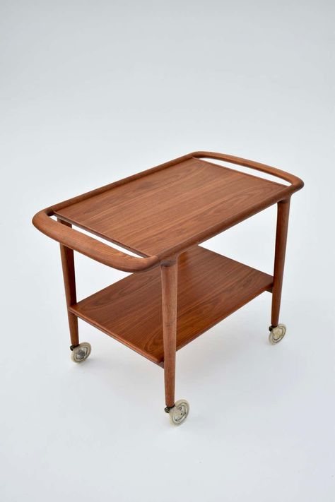 For Sale on 1stDibs - Very hard to find bar cart designed by Niels Moller in 1959. Produced by J L Moller this example is executed in teak. An incredibly graceful design and Niels Moller, Teak Bar Cart, Bar Cart Design, Dry Bars, Hard To Find, Bar Cart, Outdoor Ottoman, Teak, Ottoman