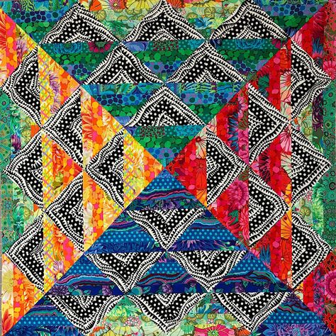 Modern Kaffe quilt in brights using the Paint box pattern by Colourwerx and a Kaffe Rainbow Classic Plus Design Roll. Quilt kit includes the Quilt Pattern and fabric for the 48" x 48" quilt top and binding. This quilt is for beginners using the piecing technique. Fabric included in kit is what is pictured. It uses a creative grid 90 degree rulerIncluded in the Kit: Pattern, and fabric for quilt top and binding. Not Included in the Kit: Backing and Batting. Backing requires: 3.5 yards of Fabric. Kaffe Fassett Quilts Ideas, Colorful Quilts Patterns, Kaffe Quilts, Triangle Quilt Pattern, Crazy Quilts Patterns, Block Quilts, Big Block Quilts, Bright Quilts, Stained Glass Quilt