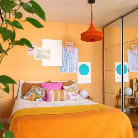 Tour a Colorful & Playful 700-Square-Foot Lisbon Apartment | Apartment Therapy Orange Light Fixture, Colourful Room, Apartment Bedrooms, Organic Modern Bedroom, Back Layers, Lisbon Apartment, Small Apartment Bedrooms, Print And Pattern, Bedroom Cozy