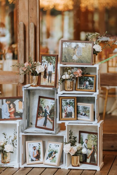 Simple and cute pre-wedding photo display arrangement in wooden elevations decorated with floral arrangements, to have at your wedding for guests to see. Wedding Photo Display Ideas, Photo Display Ideas, Wedding Photo Display, Garden Decor Diy, Wedding Display, Garden Decor Ideas, Foto Tips, Future Wedding Plans, Outdoor Wedding Decorations