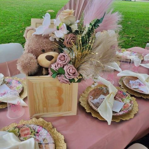 Create a striking tablescape for your outdoor baby shower party by swathing it with a dusty rose tablecloth & dressing your chairs with white spandex covers adorned with satin dusty rose chair sashes. Beautifully grace your table with floral design plates & gold round reef charger plates paired with ivory satin napkins to impart timeless elegance. Create a whimsical centerpiece by combining assorted blush flowers with pink & natural feathers to add eternal freshness to your party table decor. Outdoor Baby Shower, Blush Flowers, Party Table Decorations, Chair Covers, Party Table, Dusty Rose, Baby Shower Parties, Baby Shower Decorations, Event Decor