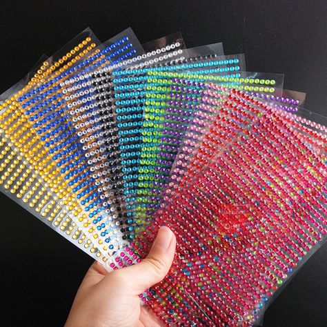 750pcs Self Adhesive Clear Rhinestone Stickers, Rhinestone Gem Stickers, Stick On Rhinestones. Deco Rhinestone Stickers. 12Kinds Colors:Transparent, Blue, Light Blue, Green, Black, Red, Pink,Rose, Purple, Gold, Citrine, Mix Colors Size: 3mm Specifications：All 12 Kinds Colors in one bag Stickers are in line strips of Rhinestones for great decoration trimming. Can cut for individual Rhinestones. So many items you can use for this deco stickers. Perfect for scrapbooking embellishments, card making Decal Nail Art, Body Craft, Crystal Stickers, Rhinestone Sticker, Deco Stickers, Diy Rhinestone, Scrapbooking Embellishments, Diamond Crystal, Craft Items