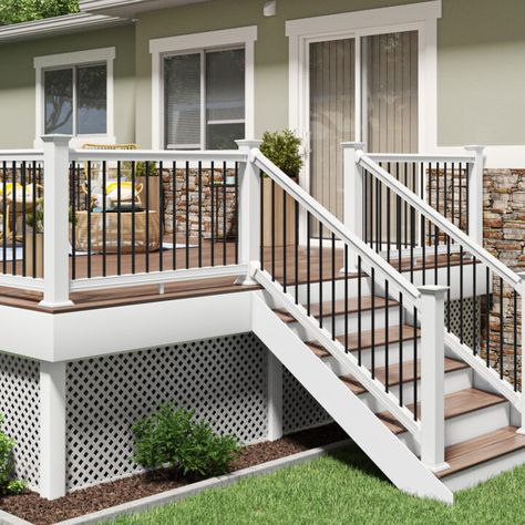 Cape Cod Porch Railing, High Porch Ideas, Raised Patio With Railings, Backdoor Steps To Patio With Railing, White Deck Railing Ideas, Tan Deck With White Railing, Pvc Deck Railing Ideas, Vinyl Deck Railing Ideas, Wood Deck White Railing