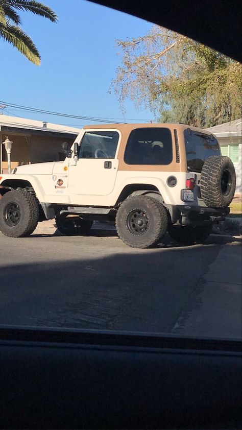 Brown and tan vintage Jeep on road Brown Jeep Aesthetic, Jeep Wrangler Old Model, Older Jeep Wrangler, 2000s Jeep Wrangler, Cream Jeep Wrangler, Jeep Wrangler Brown Interior, Old Jeeps Vintage, Vintage Jeep Aesthetic, Aesthetic Jeep Interior