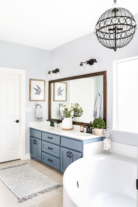 Master Bath Retreat: what a beautiful, relaxing bathroom design. Industrial and rustic elements blend flawlessly. Rustic Master Bath, Industrial Mirror, Relaxing Bathroom, Blue Vanity, Bad Inspiration, Small Remodel, Trendy Bathroom, Wood Bathroom, Blue Bathroom