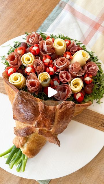 Samantha Bauchmann on Instagram: "CHARCUTERIE BOUQUET // SO much easier than it looks, I swear - plus it’s so impressive, perfect for any upcoming Mother’s Day gathering! Recipe below!   INGREDIENTS: 1 round pizza dough (got mine from the Publix bakery) 1 can pizza dough (pillsbury)  1 roll aluminum foil 1 egg (for egg wash)  Cooking spray Desired charcuterie items (used green onion for stems, arugula for floral “greenery”, prosciutto and provolone cheese for roses, tomato’s and mozzarella for tulips, and grapes for garnish. Drizzled with balsamic glaze and flakey salt)   INSTRUCTIONS: 1) preheat oven according to package. Roll out round dough on slightly floured surface, set aside. Make a wide cone out of aluminum foil, filling inside of cone with foil balls. Spray baking sheet and cone w Pizza Dough Pillsbury, Charcuterie Bouquet, Samantha Bauchmann, Charcuterie Items, Publix Bakery, Flakey Salt, Floral Greenery, Cooking Spray, Provolone Cheese