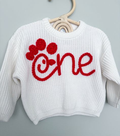 Custom Hand Embroidered Birthday Sweaters Are you looking for a sweater to fit the theme for your little one's birthday? Let's create a design that matches what you are looking for together!  MATERIALS/FIT: This set of hand embroidered sweaters are completely customizable and come in different colors. These sweaters have an oversized fit/feel, are 100% cotton, and a knit material, so they do have a stretch to them. See approximate measurements below:  Size/Length/Chest      * 0-3 M / 11 in / 12 Embroidered Knit Sweater, Embroidery Sweater Diy, Embroidered Sweaters, Birthday Sweater, Name Sweater, Sewing Machine Projects, Custom Sweaters, Embroidery Sweater, Milestone Birthday