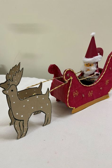 Use easily available materials at home to make your own Santa riding his reindeer sleigh. You can decorate your homes or use for school projects. Amaze your family and friends with this lovely piece of art!!! #christmas #christmasdecorationideas #santaclausmaking #diyhomedecor #santaclaus #craft #howto #projectideas #diycrafts #thanksgiving #holiday #artsandcrafts #cardboardcraft #papercraft #wastematerialcraft Diy Santa Sleigh, Christmas Craft Diy, Diy Christmas Door Decorations, Sleigh And Reindeer, Diy Christmas Door, Reindeer Sleigh, Craft From Waste Material, Sleigh Christmas, Diy Santa