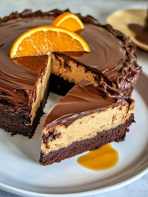 Chocolate Orange Cheesecake Layer Cake 

🍊 Ingredients 🍊
For the Chocolate Cake:
2 cups sugar 🍬
2 cups all-purpose flour 🥣
3/4 cup cocoa powder 🍫
2 tsp baking powder 🧂
1 tsp baking soda 🧪
1/2 tsp salt 🧂
2 eggs 🥚🥚
1 cup soured milk 🥛
1 cup black coffee ☕
1/2 cup vegetable oil 🛢️
1 tsp vanilla extract 🍦
2 oz orange liqueur (optional) 🍊🍸
For the Orange Cheesecake:
1 ½ pounds (3 blocks) cream cheese 🧀
1 cup sugar 🍬
3 eggs 🥚🥚🥚
1 tsp vanilla extract 🍦
3/4 cup whipping cream 🥛 Birthday Cheesecake Decoration Ideas, Chocolate Orange Cheesecake Layer Cake, Triple Layer Cheesecake, Terry's Chocolate Orange Cake, Orange Chocolate Cheesecake, Cheesecake Layer Cake, Cheesecake Decoration, Chocolate Orange Cheesecake, Layer Cheesecake