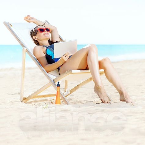 relaxed modern woman in beachwear with tablet pc sitting in a beach chair on the seacoast. Professional quality high resolution stock photo. More at http://alliance-images.com/ . . . . . # #travelblogs #uidesign #webdeveloper #contentstrategy #solopreneur #creativestudio #stockphoto #digitalmarketing #designthinking #contentmarketing #pc #tablet #relaxed #tanning #screen #beachwear #moisturizer #journey Sitting On Beach Pose, Beach Chair Poses, Summer Pose, Chair Pose, Summer Poses, Poses Reference, Human Poses Reference, Beach Chair, Human Poses