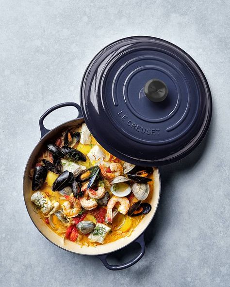 Weeknight Bouillabaisse | Crate & Barrel French Fish Soup, Bouillabaisse Recipe, Cast Iron Braiser, Fish Soup, Large Shrimp, Yukon Gold Potatoes, Dry White Wine, Enameled Cast Iron, Fresh Seafood