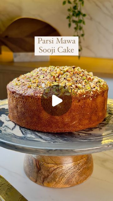 Guntas Sethi on Instagram: "✨Parsi Eggless Sooji Mawa Cake✨  Nothing screams nostalgia better than Parsi eggless sooji mawa cake and this recipe makes for the most scrumptious, moist and soft cake at home that is a delight in every bite✨😋  I got all my ingredients sorted from @ellementryhome that add style and elegance to my kitchen❤  Recipe: -2 tbsp custard powder -1.5 cups warm milk -1.5 tsp vinegar -1/2 cup Maida  -100 grams Mawa  - 3/4 cup superfine rawa  -1/2 cup + 2 tbsp caster sugar -1/2 tsp baking soda -1 tsp baking powder -1/4 tsp elaichi powder - 4 tbsp melted ghee/butter  For the Mawa:   - 2 tbsp Butter  - 1/4 cup Milk  - 1 cup Milk Powder  🍰Chopped Nuts as needed for topping  🍰Bake is at 180 degrees for 40-45 mins or until done.   [chef guntas, chef g, home made, home recipe How To Make Eggless Cake At Home, Milk Powder Cake Recipe, Sooji Cake Recipe, Maida Cake Recipe, Eggless Tea Cake Recipe, Ghee Cake Recipe, Mawa Cake Recipe, Home Made Cake, Butter Cakes