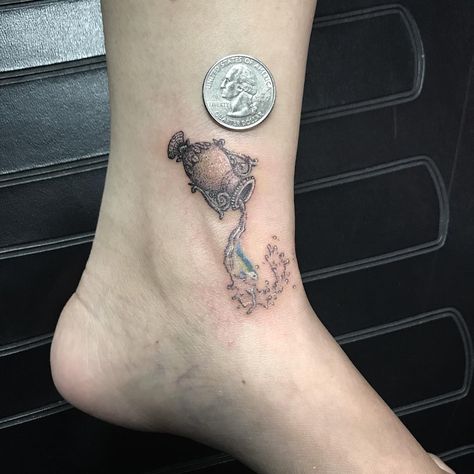 Aquarius Water Bearer Tattoo | Tattoo Ideas and Inspiration Water Bearer Tattoo, Aquarius Symbol Tattoo, Symbols Ideas, Gardenia Tattoo, Aquarius Tattoos, Aquarius Constellation Tattoo, Aries Constellation Tattoo, Kitten Tattoo, Floral Back Tattoos