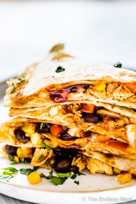 PIN TO SAVE FOR LATER! This is the ultimate chicken quesadilla recipe. Loaded with saucy bbq chicken, lots of melty cheese, and Tex-Mex favorites like corn, black beans, and bell peppers, they are always a winner. You'll love how quick and easy they are to make! #theendlessmeal #chickenquesadilla #quesadillas #chicken #mexican #mexicanrecipes #easyrecipes #texmex #texmexrecipes #familyrecipes #appetizers #gameday #gamedayrecipes #tacos #fajitas #bbqchicken Slow Cook Chili, Best Quesadillas, Easy Chicken Quesadilla, Easy Chicken Quesadilla Recipe, Quesadillas Chicken, Bbq Chicken Quesadilla, Chicken Mexican, Chicken Quesadilla Recipe, Quesadilla Recipe