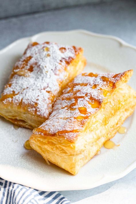 Air fryer puff pastry makes the perfect dessert! Throw puff pastry in the air fryer and serve with different toppings for an easy and delicious treat. Air Fryer Phyllo Recipes, Air Fryer Phyllo Dough Recipes, Air Fryer Cream Puffs, Puff Pastry In Air Fryer, Airfryer Pastries, Puff Pastry Recipes Air Fryer, Air Fryer Pastry Recipes, Airfryer Puff Pastry Recipes, Cronuts Puff Pastry