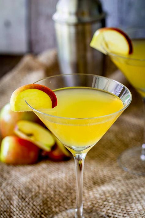 This Caramel Apple Martini is the perfect fall cocktail. Starting with a vodka base and then adding the warming and comforting flavors of caramel, toffee and butterscotch together with apple cider, you can create an autumn drink that is fun, easy to make for two or you can make up big batches if you are serving a crowd for a party. (You can also call this a Toffee Apple Martini). #cocktail #fallcocktail #toffeeapple #caramelapple #martini Caramel Apple Martini, Autumn Drink, Apple Martini, Fall Cocktail, Caramel Toffee, Toffee Apple, Fall Cocktails, Fall Drinks, Martini Cocktail