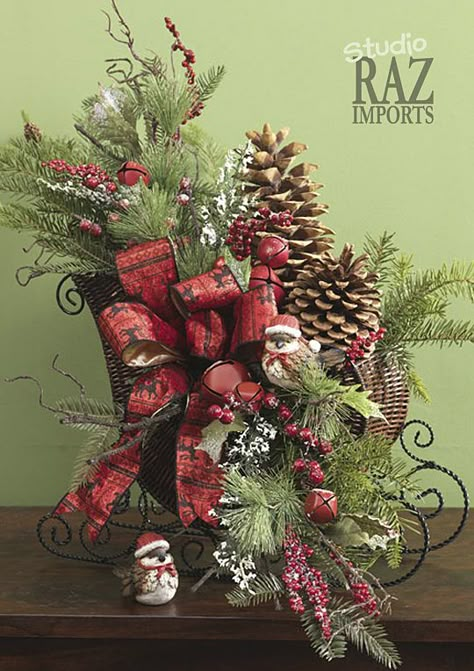 Sleigh arrangement. Christmas centerpiece and decorating ideas. Small Sleigh Decorating Ideas Christmas, Wicker Sleigh Christmas Decor, Sleigh Floral Arrangements, Christmas Sleighs, Christmas Sleigh Decorations, Christmas Florals, Christmas Centers, Centerpiece Christmas, Christmas Flower Arrangements