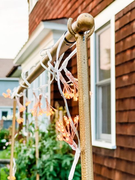 Lights on an over-the-table rod in the garden, but they are lovely inside too! Diy Over Table Rod, Over The Table Rod Diy, Over The Table Rod Decor, Backyard Renovations, Easter Shopping, Nature Decor, Dinner Table, String Lights, Curtain Rods