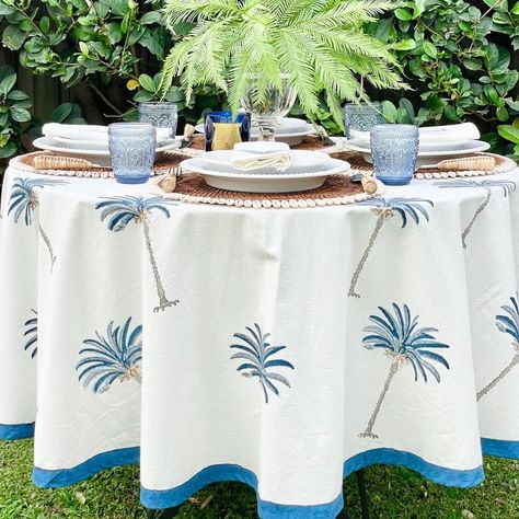 True elegance lies in simplicity. 💙 Inspired by our love 💕 for the blue seas and the lovely trees that grow on the coast, this 'Blue Palm Tablecloth' will bring you closer to nature with its lovely hues 🌴🌊 Hand block printed by skilled artisans on the finest cotton, they make for a perfect choice for all seasons. ⛱️🌴 Available in rectangular, round and square shape. Pair the tablecloth with our Blue palm napkins to make your setting more stunning! ❤️ #tabletopinspiration #nauticaltheme #c... Blue Palm Tree, Coastal Hamptons, Blue Napkins, Round Table Covers, Hamptons House, Indian Block Print, Round Decor, Coastal Style, Round Tablecloth