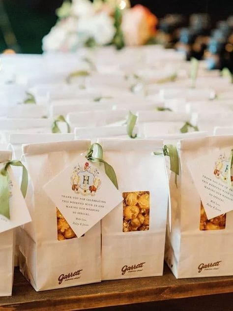 15 Cute Wedding Popcorn Bar Ideas + How To Set Them Up Wedding To Go Snacks, Wedding Favor Popcorn, Popcorn Gift Bags Party Favors, Wedding Favors Snacks, About To Pop Popcorn Favors, Popcorn Wedding Favors For Guests, Wedding Popcorn Bar Ideas, Garrets Popcorn, Wedding Favor Snacks