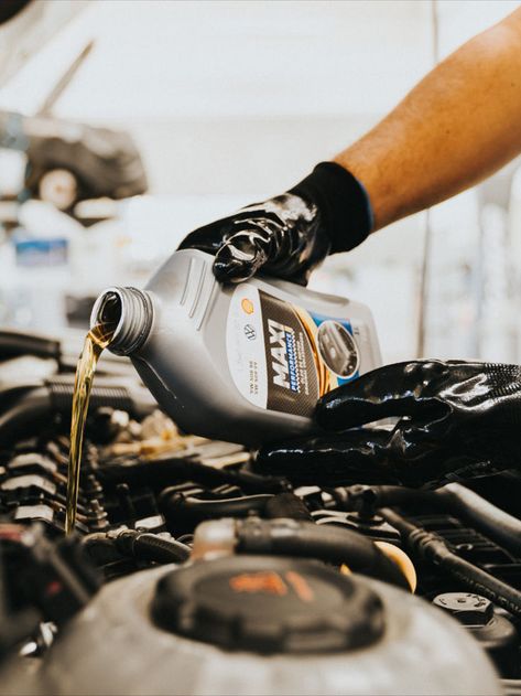 a person pouring oil into a car engine Car Mechanic Aesthetic, Mechanic Photography, Mechanics Photography, Oil Change Service, Car Oil Change, Mechanics Aesthetic, Car Mechanics, Automobile Advertising, Car Oil