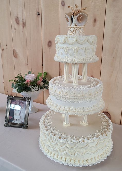 I was asked to recreate a grandparents wedding cake with frosted pillars Tiered Wedding Cake With Pillars, Wedding Cakes Old Fashioned, Wedding Cake Columns, Wedding Cake With Pillars And Flowers, Traditional Tiered Wedding Cake, Wilton Wedding Cakes Vintage, 3 Tier Wedding Cake With Pillars, Vintage Wedding Cake With Pillars, Wedding Cake With Columns