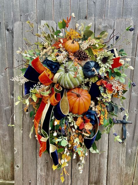 Wreath 8 Fall Wreath, Autumn Wreath Fall Decor. Fall Wreath for Front Door, Pumpkin Wreath (L)!43.  (W) 30 Designed on an Evergreen Wreath Base with Deco Mesh added for Fullness and Color. There are Two Large Pumpkins and Smaller Ones. There is a Gorgeous Bow Made with Designer Navy Blue Velvet Ribbon with Gold Backing, Orange Velvet, and a Green Velvet. There are Loads of Fall Florals, Fall Picks Fall Sprays, Berries and Mounds of Greenery. This Wreath will Be Warm Greeting for your Guest  During the Fall Season.  Ready to Ship Navy And Orange Wreaths, Orange Wreaths, Door Fall Decor, Orange Fall Decor, Blue Velvet Ribbon, Fall Mantle Decor, Fall Decor Wreaths, Large Pumpkins, Fall Wreath For Front Door