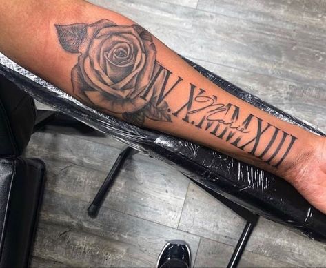 Low Sleeve Tattoos For Women, Roman Numeral Tattoo Men Arm Half Sleeves, Ezekiel Tattoo Name, Rip Arm Tattoos For Women, Mom Name Tattoo For Men Forearm, Forarm Tattoos Mens Creative, Mens Thigh Tattoos Ideas, Roman Numeral Tattoo Men Forearm, Name Tattoo On Forearm