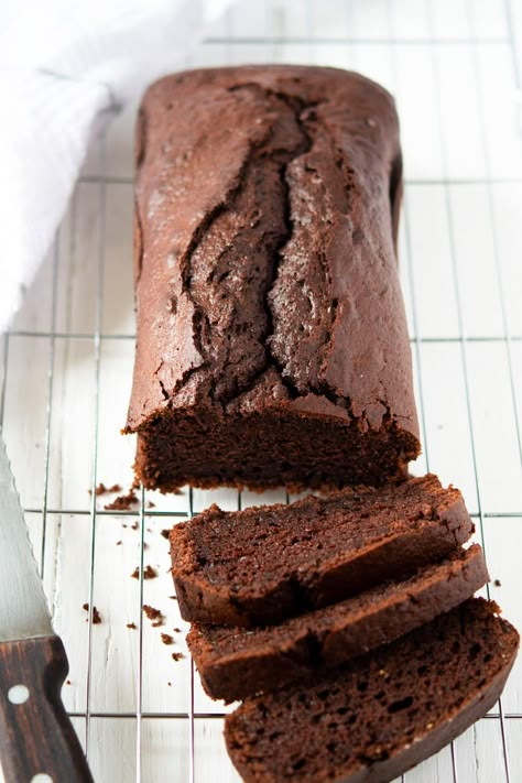 An easy, one bowl recipe for a chocolate loaf cake. The cake uses yogurt to reduce calories and keep the cake super moist. It's a simple cake that will satisfy your chocolate cravings. Chocolate Yogurt Bread, Healthy Chocolate Loaf, Chocolate Cake Loaf, White Chocolate Yogurt, Yogurt Loaf Cake, Chocolate Yogurt Cake, Chocolate Loaf Cake, Chocolate Yogurt, Loaf Cakes