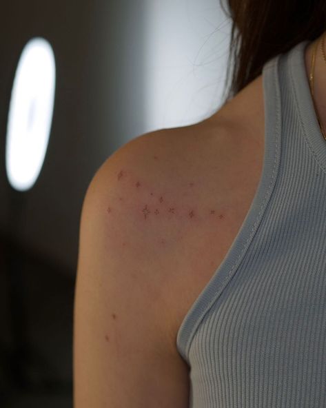 Small Stars On Shoulder Tattoo, Stars On The Shoulder Tattoo, Tiny Tattoos On Shoulder, Small Star Tattoos On Shoulder, Starry Shoulder Tattoo, Tattoo Sagittarius Constellation, December Constellation Tattoo, Tiny Stars Tattoo Shoulder, Brown Star Freckle Tattoo