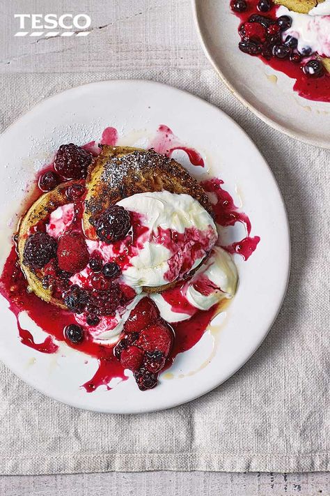 Do more than just spread them with butter – transform crumpets into this indulgent French toast brunch. Fluffy crumpets are fried until golden and topped with bright berry compote and a dollop of yoghurt for a new twist on a brunch classic. | Tesco Crumpets Toppings, British Breakfast Recipes, Breakfast In Bed Ideas, Crumpet Recipe, Classic French Toast, Rhubarb Crumble, Tesco Real Food, Berry Compote, Recipe Breakfast