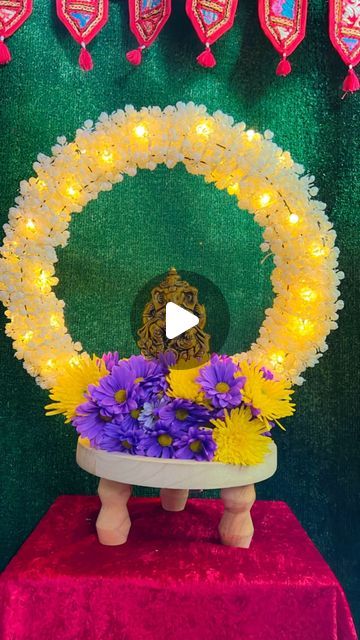 Krishna Home Decor on Instagram: "Easy Ganpati Aasan
So many of you requested to create a simpler Ganpati decor, so here it is! All you need is a metal wreath from @dollartree and garlands. You can use any type of garlands you like. The base is a wet floral foam. I used fresh flowers but you can also use faux flowers. The led fairy lights are from Amazon as well. 
I saw my friend @aura.of.happiness create something similar last year as well. Checkout her page, because she creates some of the best decor setups.

#ganesha #ganpati #bappa #ganesh #ganpatibappamorya #mumbai #ganeshchaturthi #morya #india #maharashtra #ganpatibappa #bappamorya #ganeshutsav #hindu #lordganesha" Ganpati Bappa Decoration At Home, Best Ganpati Decoration At Home, Ganpati Bappa Decoration, Krishna Home Decor, Easy Ganpati Decoration, Flower Decoration For Ganpati, Ganesh Design, Ganpati Decor, Ganpati Decoration At Home