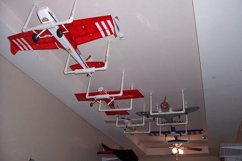 Garage ceiling plane storage (looking for plans) - RCU Forums Rc Plane Storage Ideas, Rc Airplane Storage Ideas, Model Airplane Display Ideas, Model Planes Display, Plane Hanging From Ceiling, Airplane Hanger Design, Rc Workshop, Model Airplanes Display, Hanging Rc Airplanes