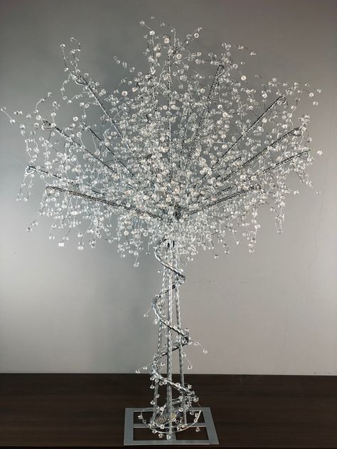 What makes this glitter tree special? All handmade high-purity acrylic beads, powered by an external battery box, you can place them on the table at will, adding romantic colors to your wedding and birthday parties. Especially at night, it shines brightly, putting you in a shining fantasy realm。 Overall Height: 36″ Base Diameter: 6.3inch Material :metal, acrylic Color：Silver Weight: Around 5LBs Power Mode: Battery Controlled Battery Included : NO Control Battery：3 AA Batteries White Tree Centerpieces, Sparkly Wedding Decorations, Snowflake Centerpieces Wonderland, Spiral Centerpiece, Sparkly Wedding Decor, Winter Wonderland Wedding Centerpieces, Winter Reception, Crystal Wedding Decor, Sweet 16 Winter Wonderland