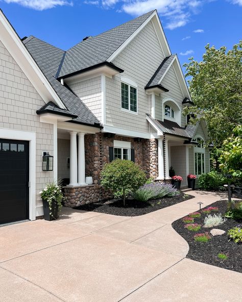 NEVER BEFORE SEEN pictures of our exterior on my feed. Swipe all the way to the end to see what our exterior looked like when we moved in 7 years ago. What did we do? Painted the house BM Revere Pewter, swapped out the shakes for cement board shakes, replaced the roof with an architectural shingle, added black gutters, replaced the garage doors & exterior lights, redid the landscaping & replaced the front door. If we never move (🙃 those who know, know) we will eventually swapped out the s... Garage Doors Exterior, Revere Pewter Exterior House, Aged Pewter Hardie Board Siding, Owens Corning Shingles Estate Gray, Estate Gray Shingles Owens Corning, Gaf Timberline Shingles Pewter Gray, Black Gutters, Bm Revere Pewter, Black Garage Door