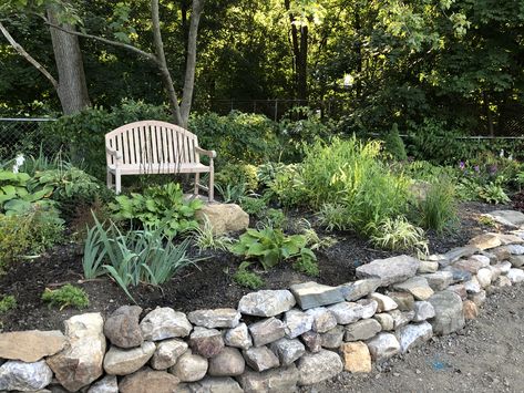 Just completed this dry stack retaining wall of mainly field rubble around an existing flower bed. Rock Wall Flower Bed, Dry Stack Retaining Wall, Stacked Stone Flower Bed Border, Rock Wall Garden Bed, Stone Wall Flower Bed, Hacienda Landscape, Driveway Wall, Landscape Boarders, Field Stone Wall