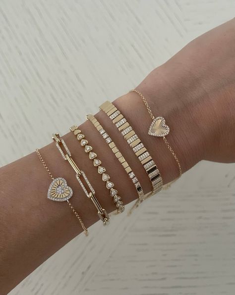 This beautiful bracelet features hearts set with round diamonds. The bracelet features solid gold hearts too. 14K Yellow Gold Length: 6" + 1" extender 14 Round Diamonds 0.37tcw 6.24 grams Heart measurement: 3.5mm with diamond and 3.2 solid gold heart Diamond heart section measurement: 2" Dimond Breslet, Round Diamond Bracelet, خواتم خطوبة, Gold Bracelets Stacked, Gold Diamond Bracelet, Expensive Jewelry Luxury, Gold Hearts, Hand Accessories, Heart Diamond