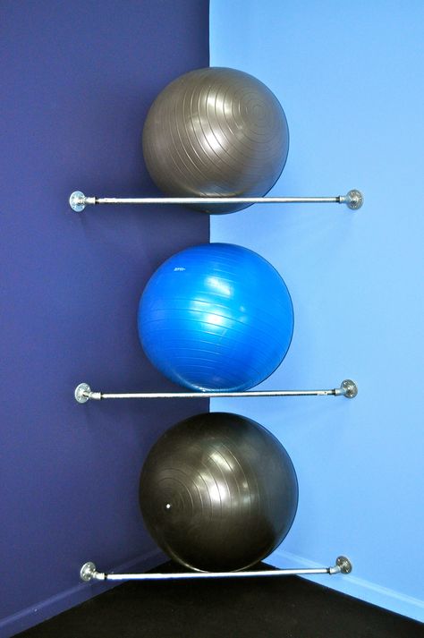 Yoga Ball Storage Ideas, Physio Room Design, Workout Ball Storage, Pilates Ball Storage, Physical Therapy Gym Design, Therapy Gym Design, Workout Room Aesthetic, Physiotherapy Room Decor, Yoga Ball Storage