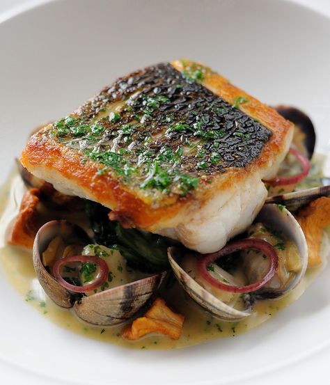 Simon Hulstone's sophisticated sea bass recipe creates a remarkable medley of seaside flavours with cod cheeks, fish sauce and clams. Cod Cheeks, Sea Bass Recipe, Poached Cod, Bass Recipe, Sea Bass Recipes, Great British Chefs, Clam Recipes, Fine Dining Recipes, Munnar