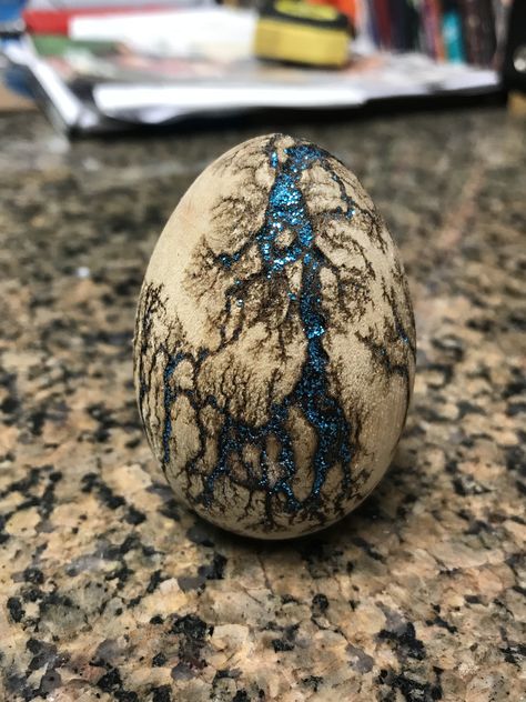 Dragon egg Dinosaur Egg Art, Diy Dragon Eggs, Dragon Eggs Diy, Dragon Eggs, Dragon Egg Art, Dragon Egg Rock Painting, Dragon Eggs Tutorial, Dragon Egg Diy, Dragon Egg Painted Rocks