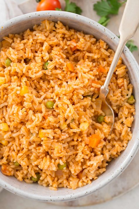 Homemade Spanish Rice (also known as Mexican Rice) is an easy one-pot side dish to serve with your favorite Mexican entrees. Mexican Fried Rice, Homemade Mexican Rice, Cooked Rice Recipes, Homemade Spanish Rice, Rice With Corn, Spanish Rice Recipe Easy, Spanish Rice Easy, Mexican Rice Easy, Spanish Rice Recipe