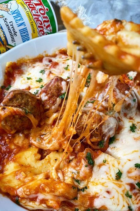 This Cheesy Ravioli is packed with flavor. Here, it's shown alongside a can of Tony Chachere's with a tasty bite being prepared. Ravioli And Meatballs, Cheesy Ravioli, Ravioli Casserole, Meatball Casserole, Mardi Gras King Cake, Frozen Meatballs, Herb Seasoning, Easy Cheesy, Spice Recipes