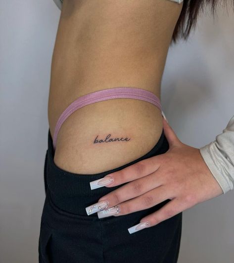 22 Stunning Hip Tattoo Designs You Really Wanna See Name Tattoos For Women Hip, Side Hip Word Tattoo, Hip Name Tattoo, Hip Script Tattoo, Upper Hip Tattoos Women, Hip Tattoo Text, Women Rib Tattoo, Side Waist Tattoo, Front Hip Tattoo